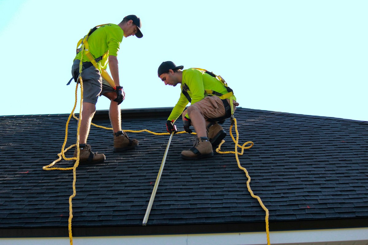 Roofing team working on a home
